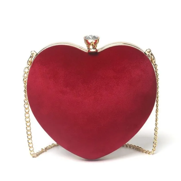 Heart-shaped hand holding chain bag